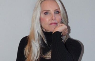 Linda Holliday smiling at a public event