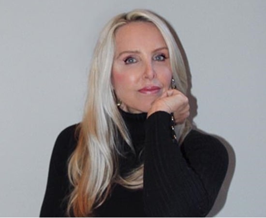 Linda Holliday smiling at a public event
