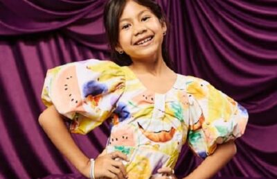 Maia Kealoha smiling in a studio portrait as Disney’s Lilo